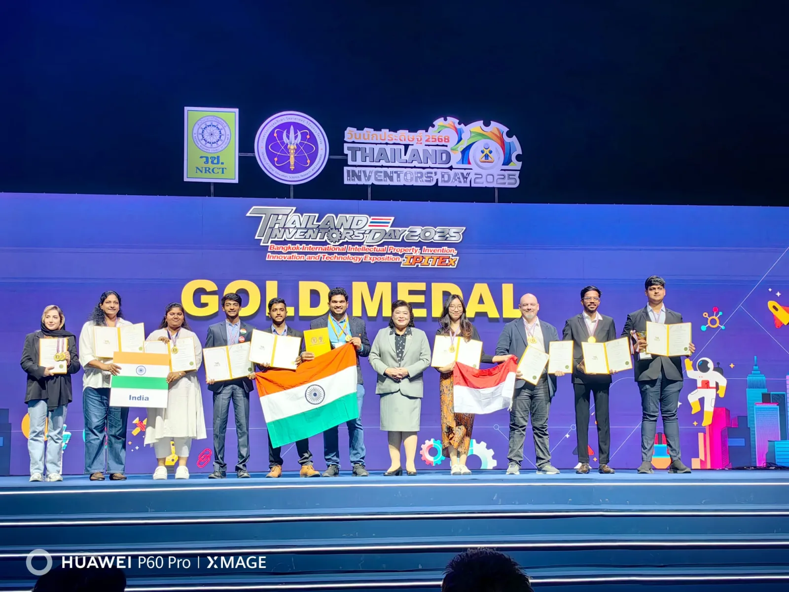 Gold medal recipients on stage at IPITEx 2025.