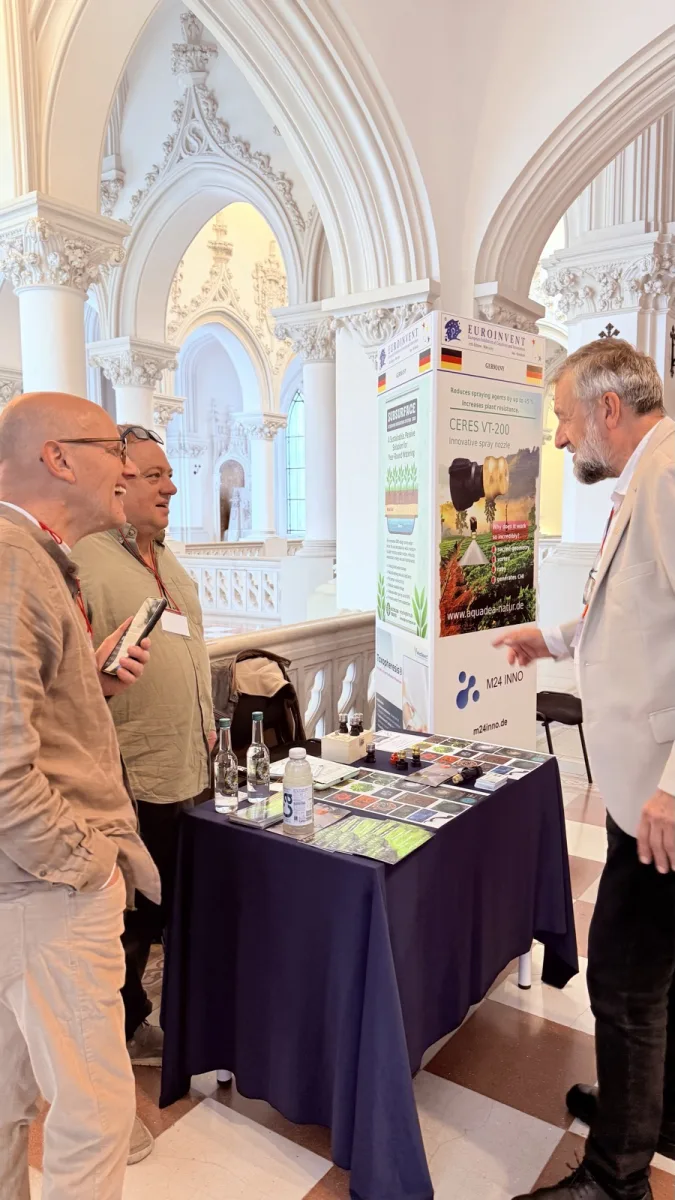 An exhibitor presenting work at EUROINVENT 2025.