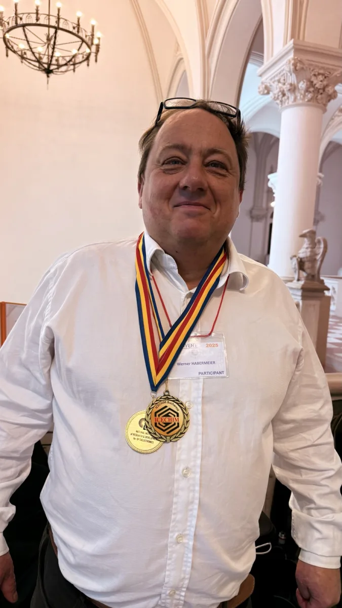 Participant wearing a medal at EUROINVENT 2025.